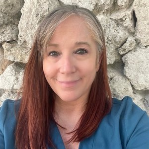 Mary Abraham, licensed massage therapist and certified lymphatic drainage therapist, performing manual lymphatic drainage at Balance Spa in Boca Raton, FL.]