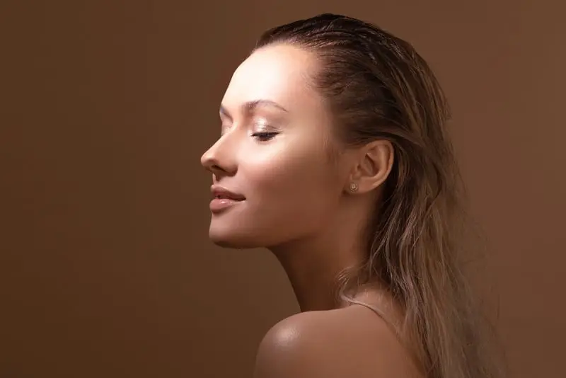 Calm woman with smooth, glowing skin