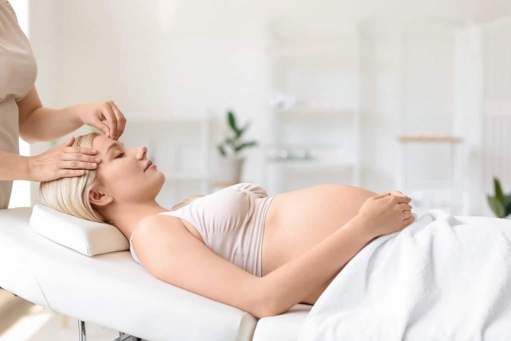 Massage therapist administering a specialty prenatal massage
